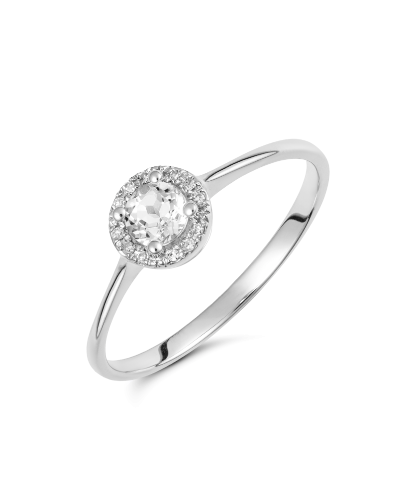 White gold ring with diamonds and clear topaz