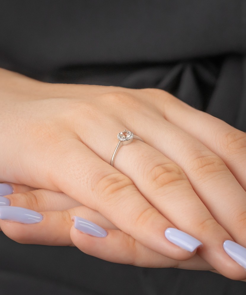 White gold ring with diamonds and clear topaz