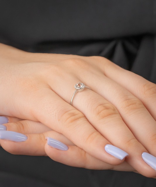 White gold ring with diamonds and clear topaz