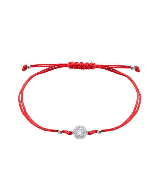 Red string bracelet with a silver pendant with zirconium