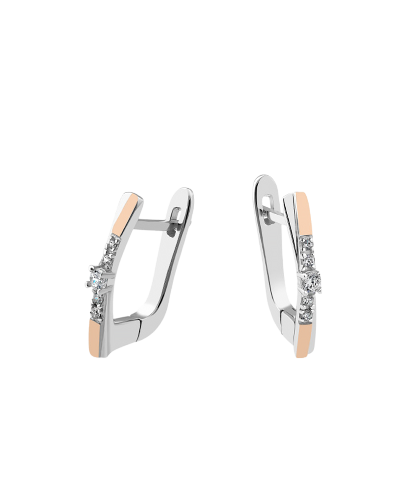 Hopeiset korvakorut peittää kullalla zirkoneilla