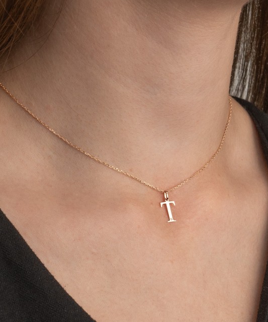 Gold pendant with diamond letter T