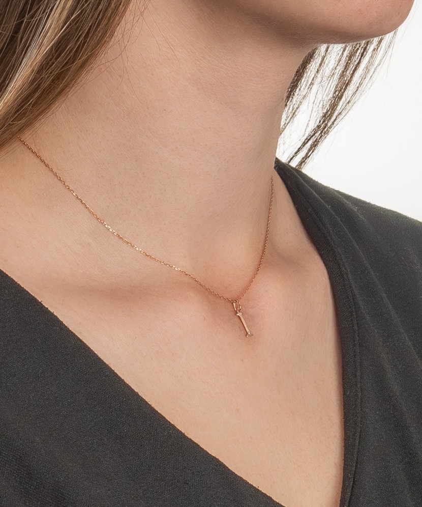 Gold pendant with diamond letter I