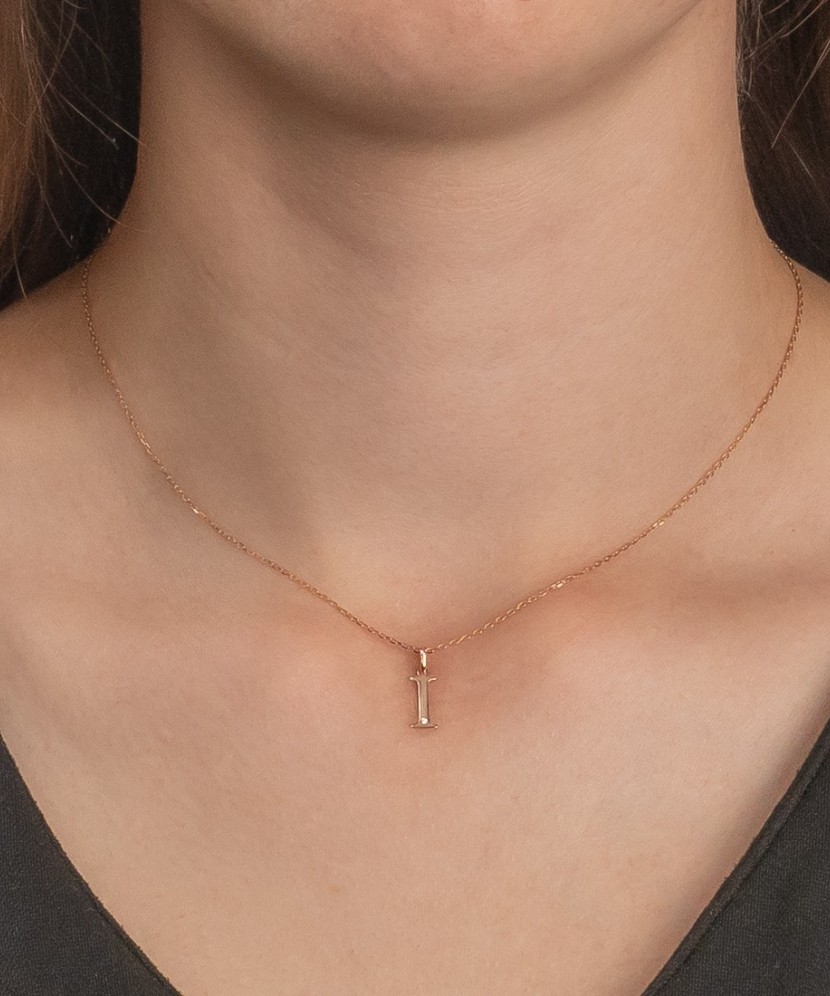 Gold pendant with diamond letter I