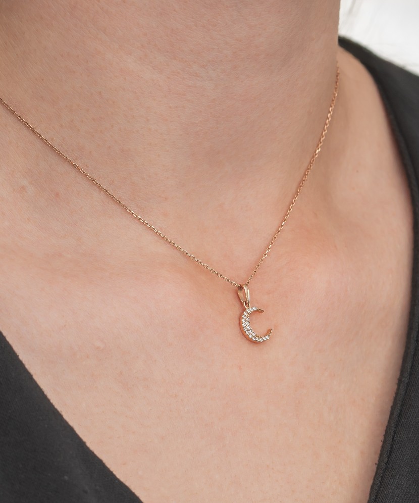 Gold pendant with zircons