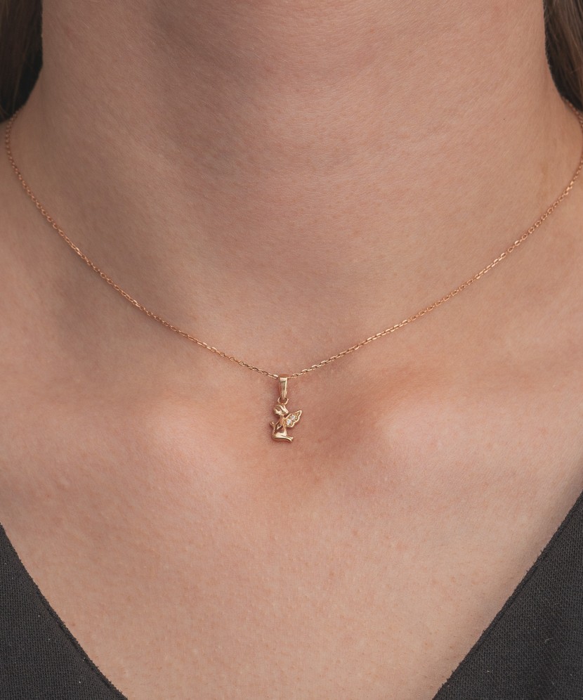 Gold pendant with zircons "angel"