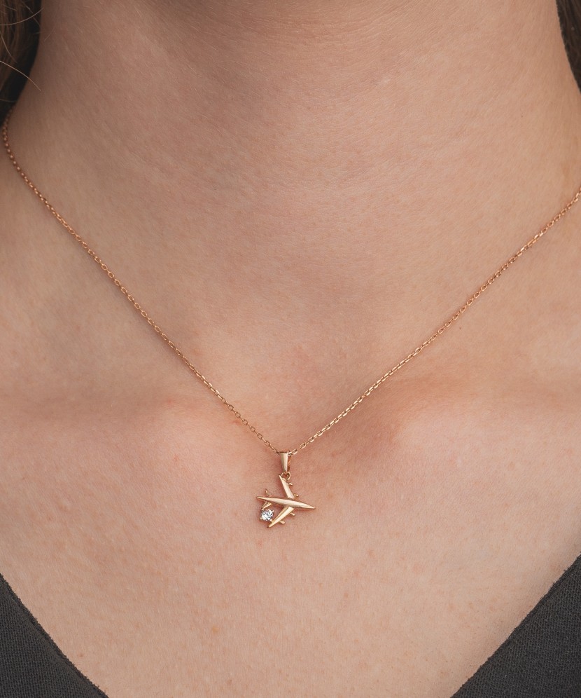 Gold pendant with zircons