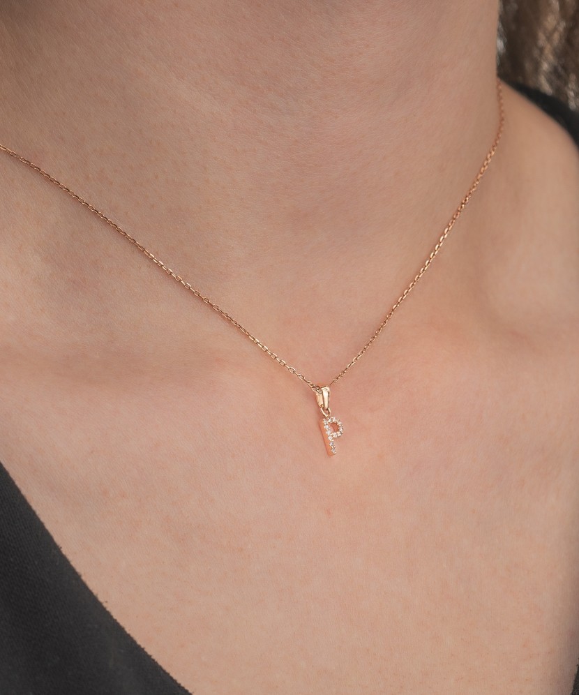 Gold pendant with zircons Letter P