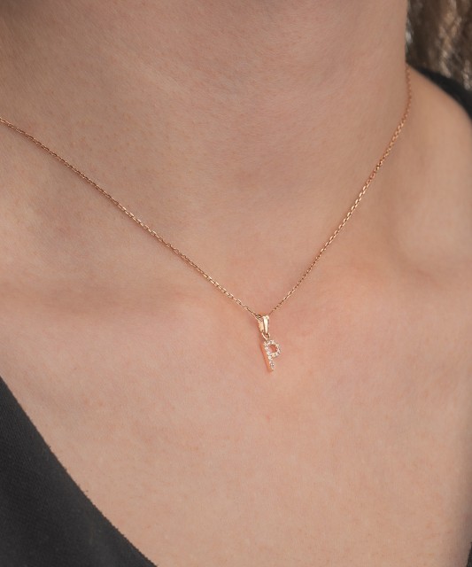 Gold pendant with zircons Letter P