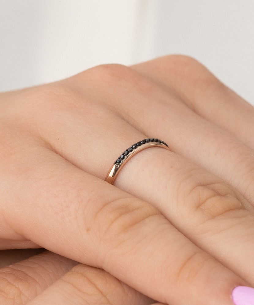 Gold ring with black diamonds