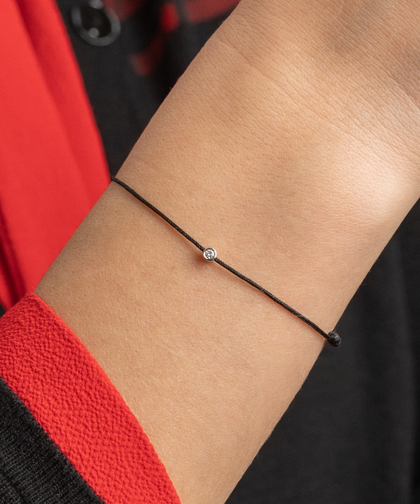 Black string bracelet with white gold and diamond pendant 0.03ct