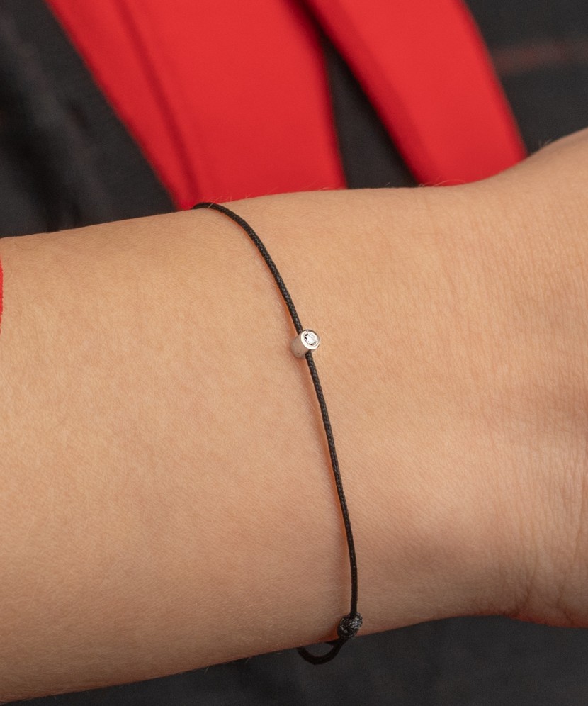 Black string bracelet with white gold and diamond pendant 0.03ct