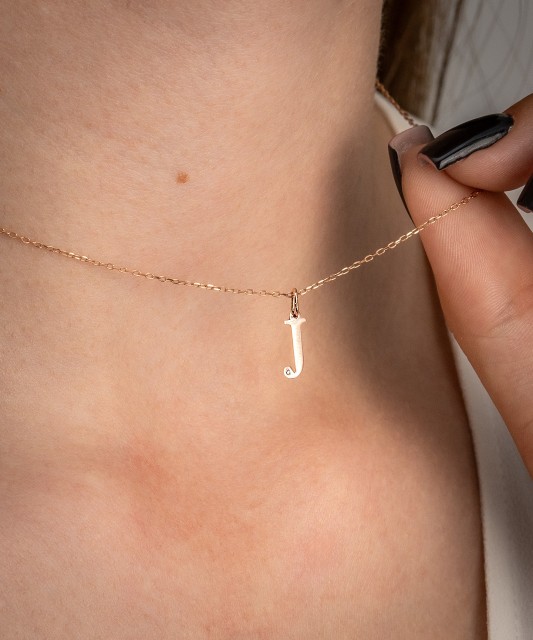 Gold pendant with diamond letter J