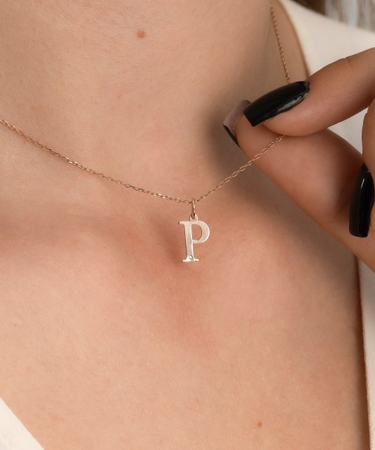 Gold pendant with diamond letter P