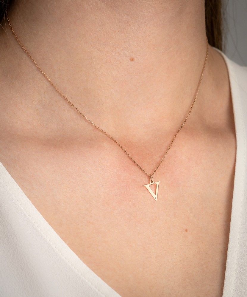 Gold pendant with diamond letter V