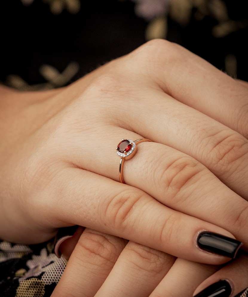 Gold ring with diamonds and garnet