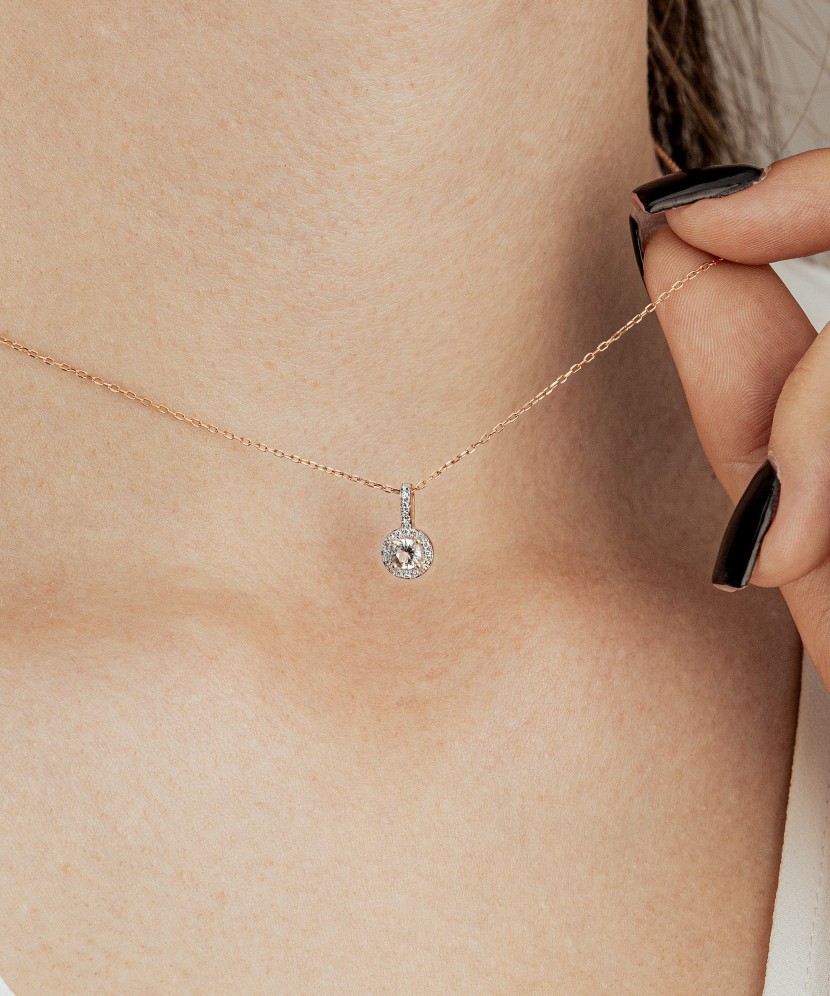 Gold pendant with diamonds and clear topaz