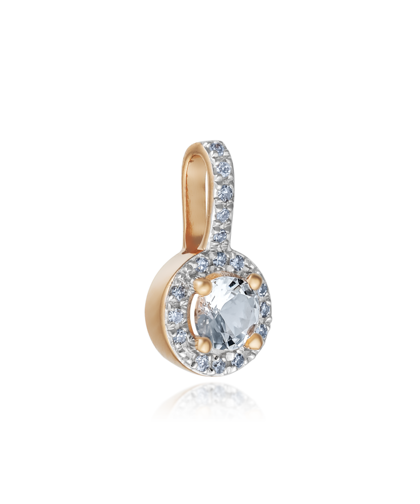 Kultainen riipus timantilla ja kirkkaalla topaasilla