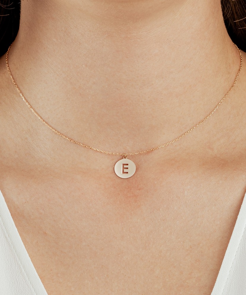 Gold chain with pendant letter E