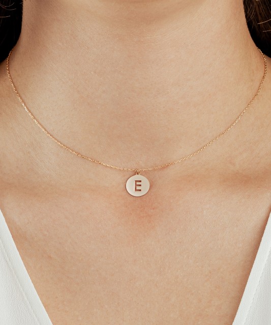 Gold chain with pendant letter E