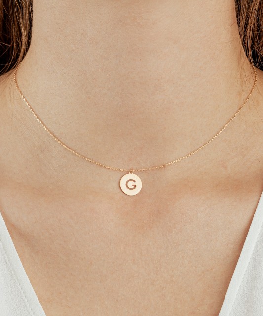 Gold chain with pendant letter G