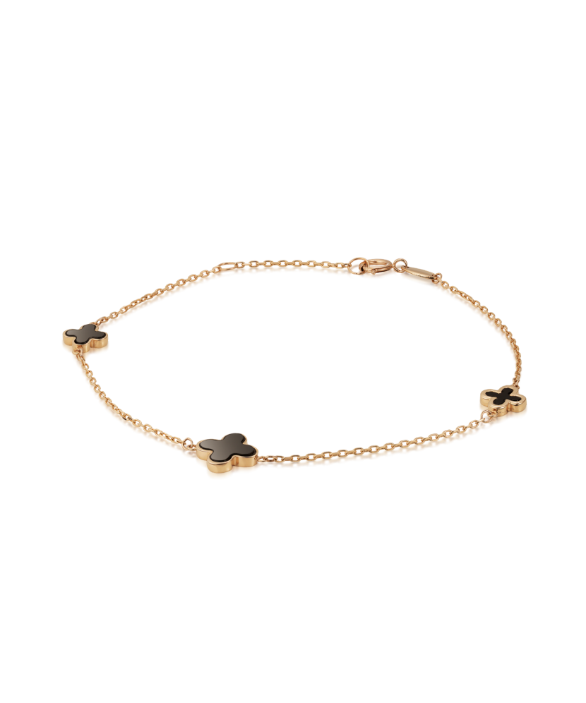 Kultainen rannekoru onyxilla