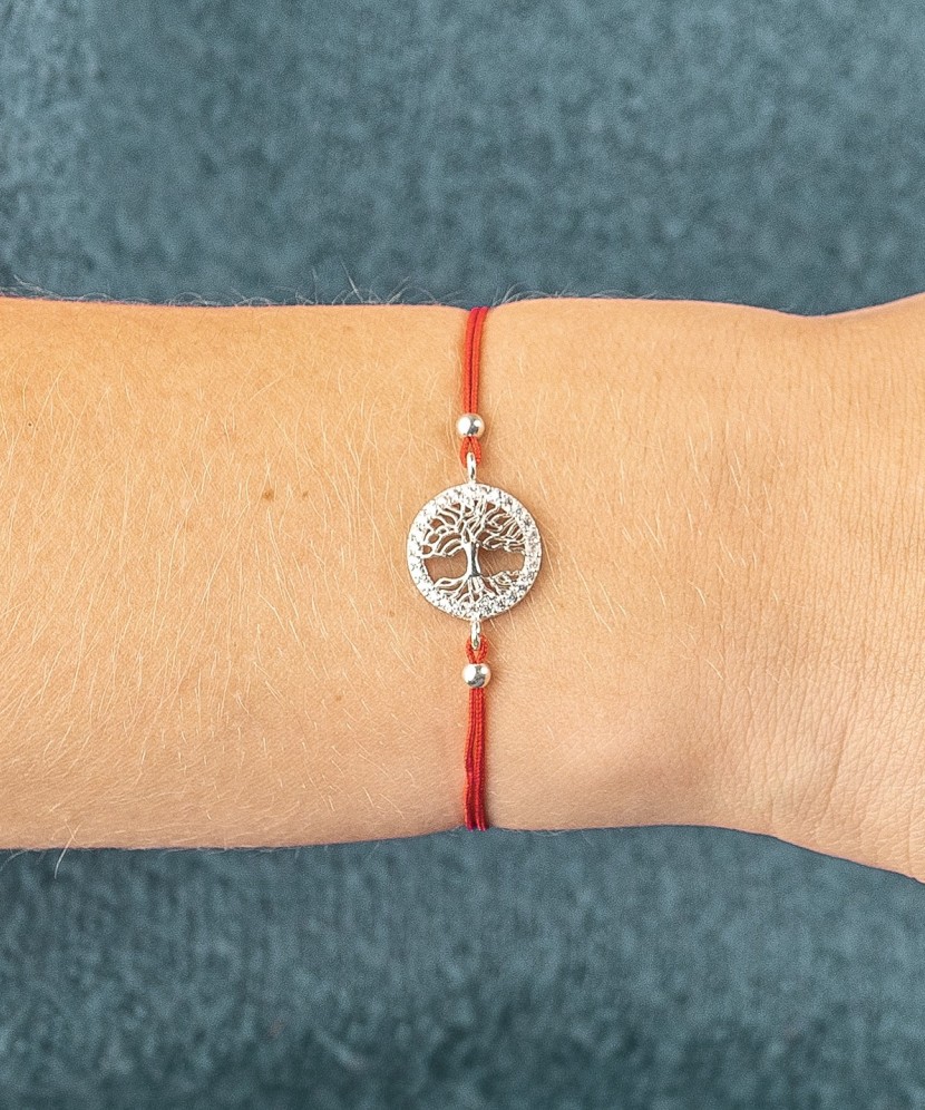 Red string bracelet with a silver pendant "Tree of life"