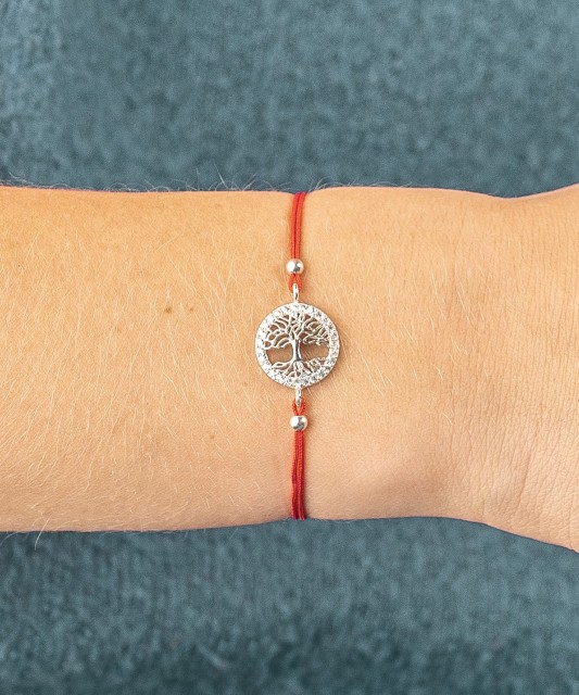 Red string bracelet with a silver pendant "Tree of life"