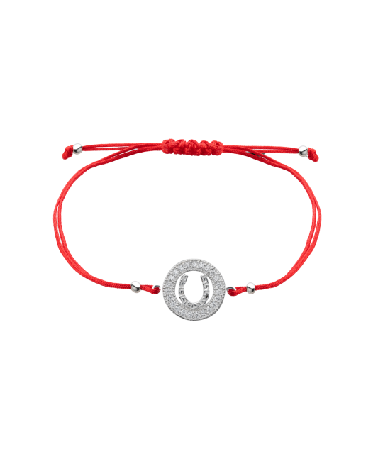 Red string bracelet with a silver pendant "horseshoe"