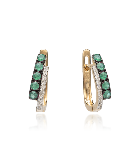 Keltakultaiset korvakorut timanteilla ja smaragdeilla