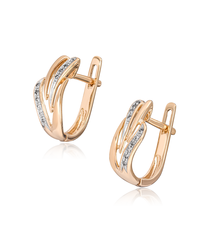 Kultaiset korvakorut timanteilla