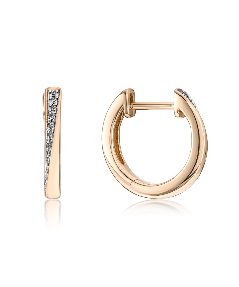 Kultaiset korvakorut timanteilla