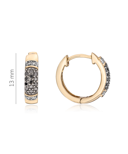 Keltaiset kultaiset korvakorut timanteilla