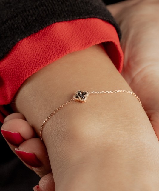 Gold bracelet with black diamonds