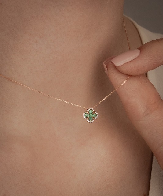 Gold chain with emerald and diamond pendant
