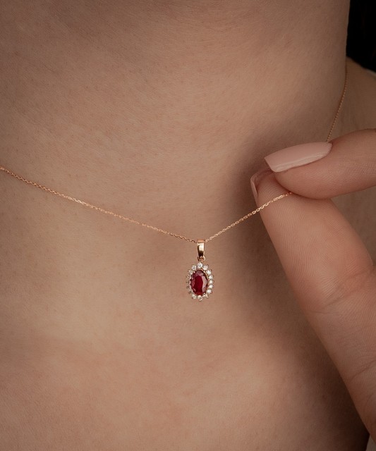 Gold chain with ruby and diamond pendant