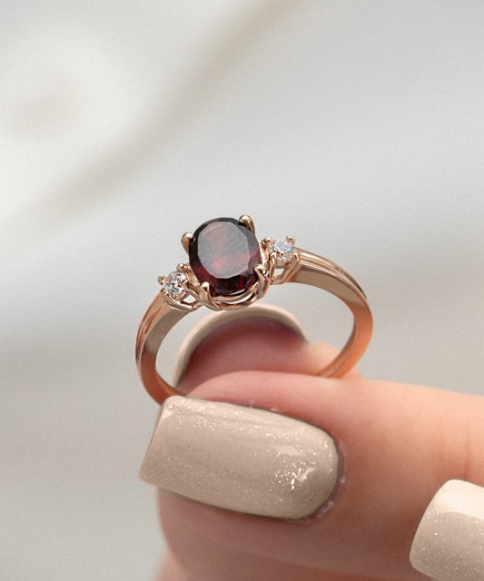 Gold ring with garnet and zircons