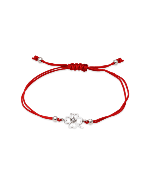 Red string bracelet with a silver pendant