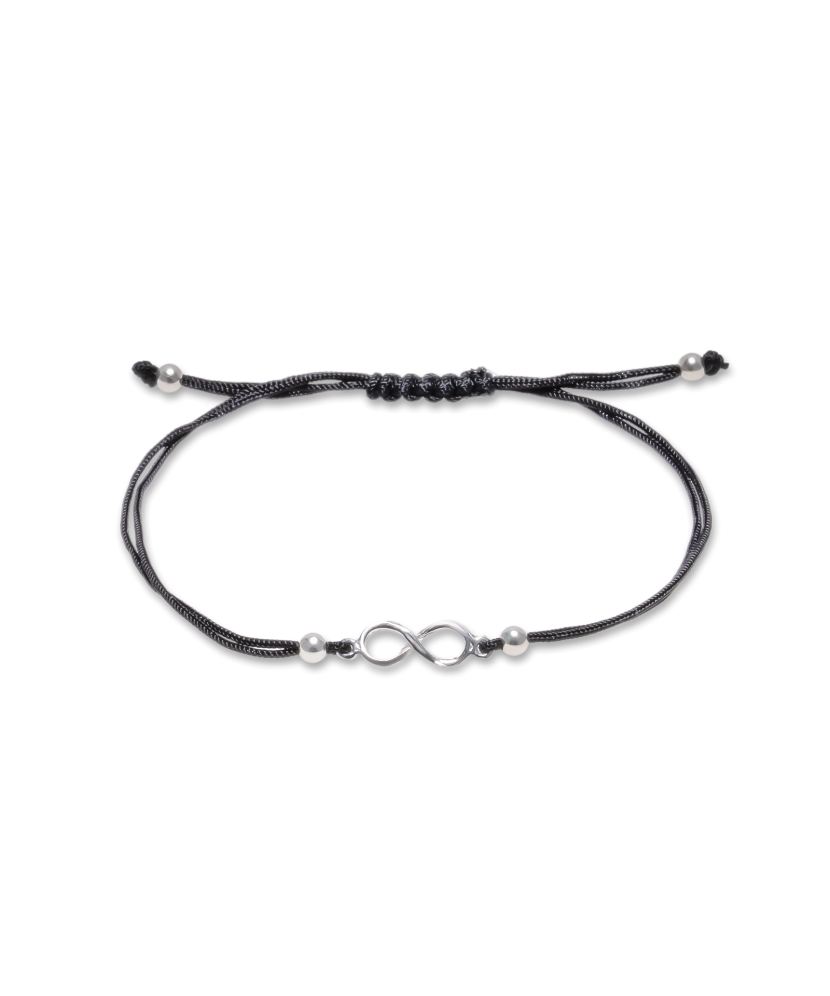 Black string bracelet with a silver pendant
