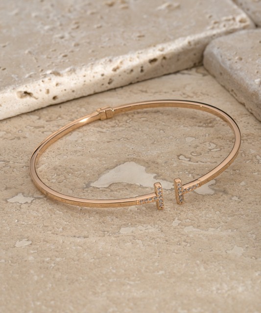 Gold hard bracelet with zircons