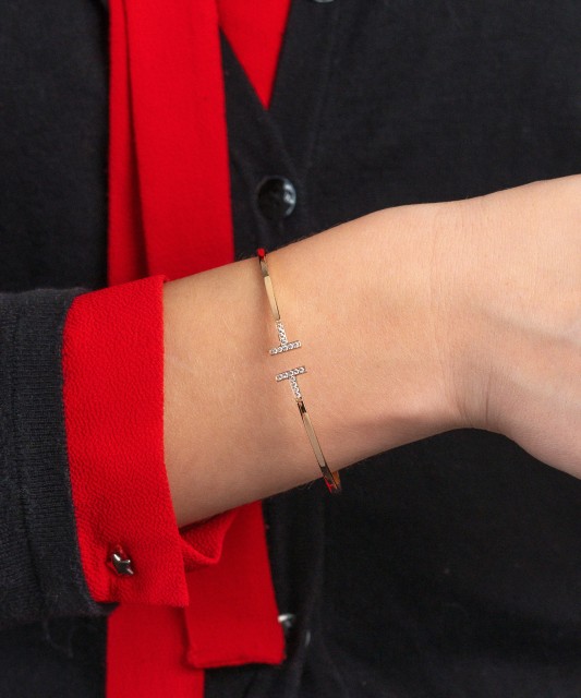 Gold hard bracelet with zircons