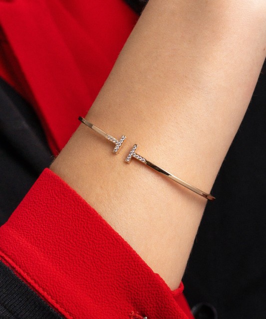 Gold hard bracelet with zircons