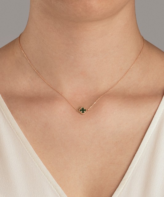 Gold necklace with a malachite pendant