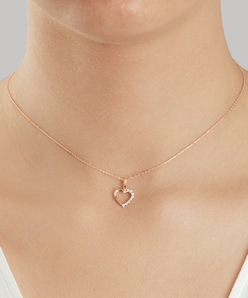 Gold pendant with zircons "cross"