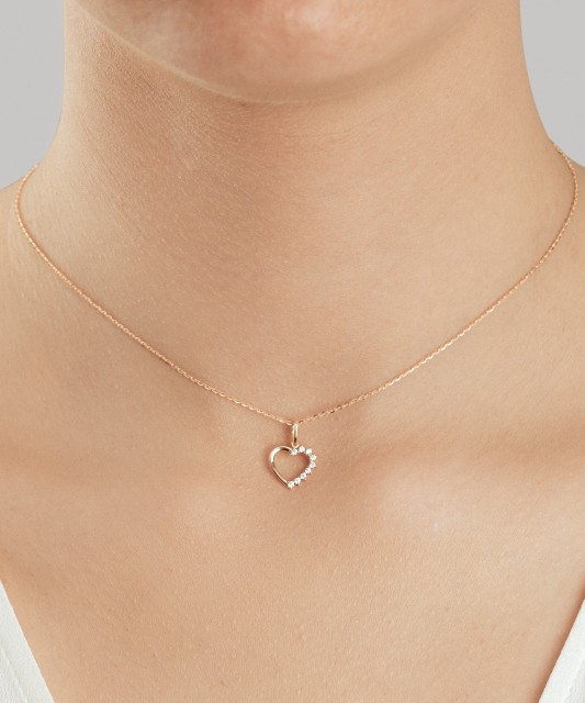 Gold pendant with zircons "cross"