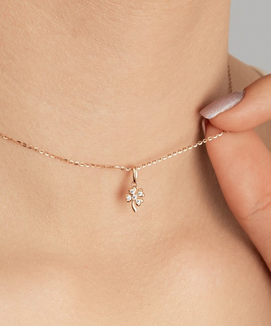 Gold pendant with zircons