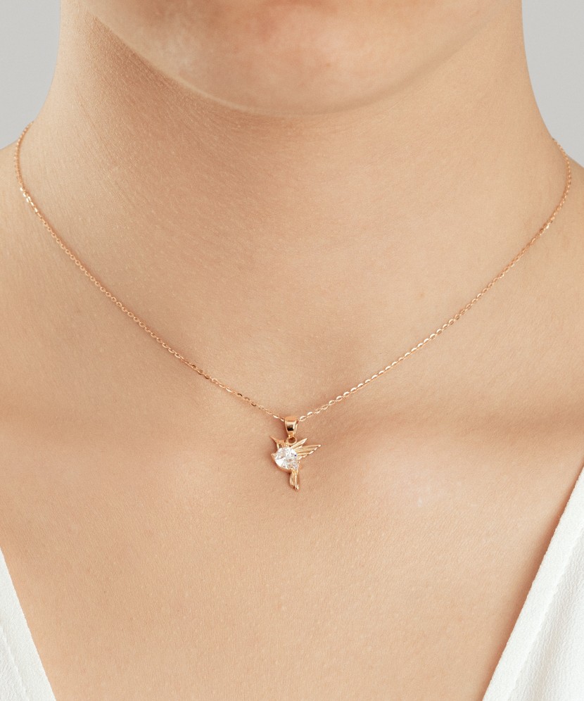 Gold pendant with zirconium "hummingbird"