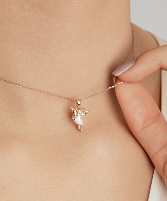 Gold pendant with zirconium "hummingbird"