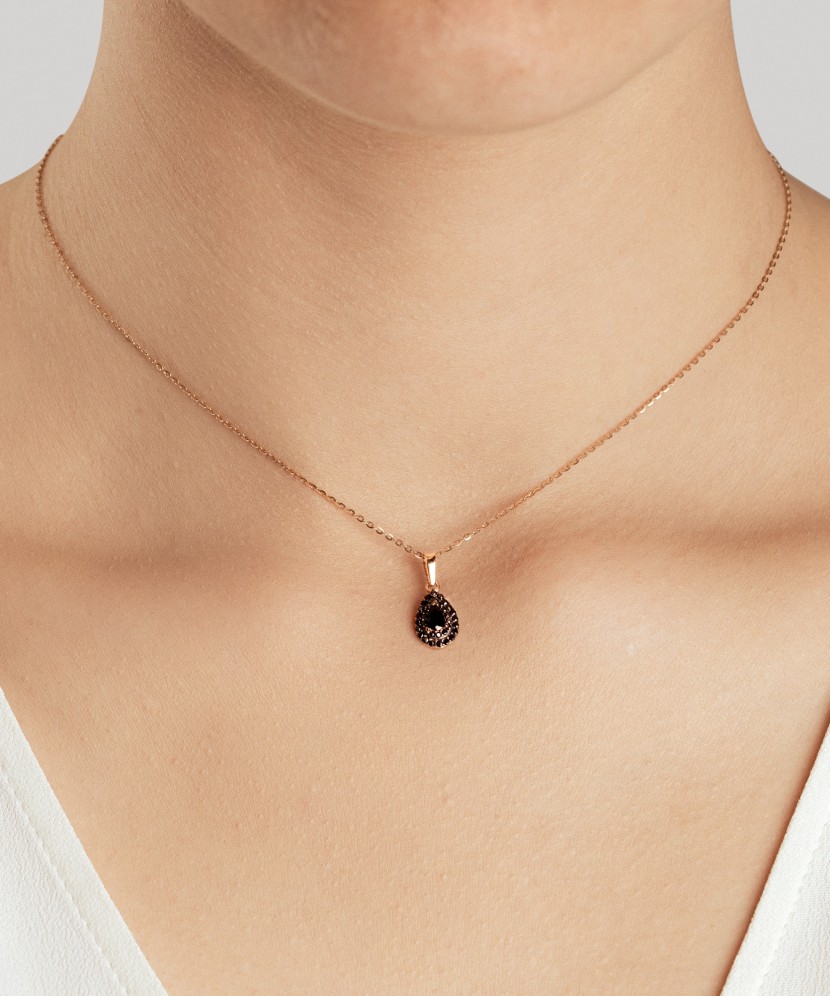 Gold pendant with zircons