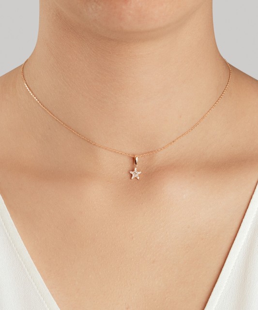 Gold pendant with zircons "star"